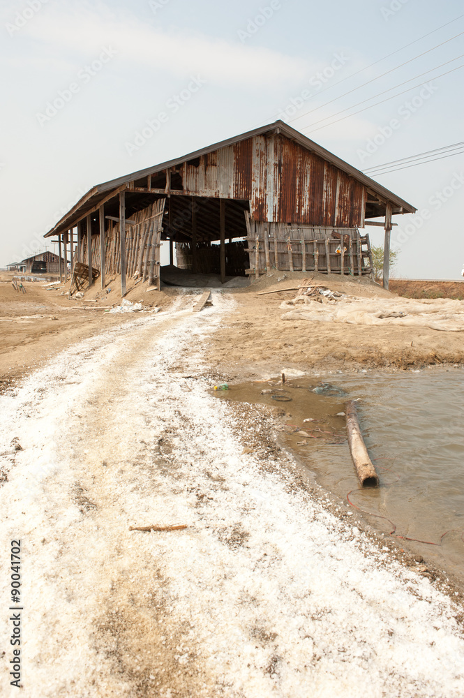 Farmer working at Salt pile in Thailand Farmer working at Salt pile in Thailand