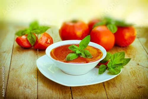 Tomato soup in white bowl