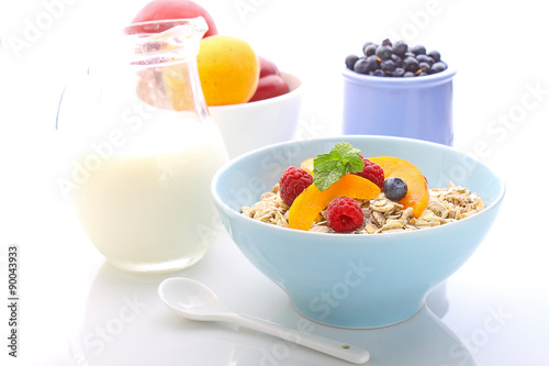 muesli (granola) with berries and yogurt for breakfast