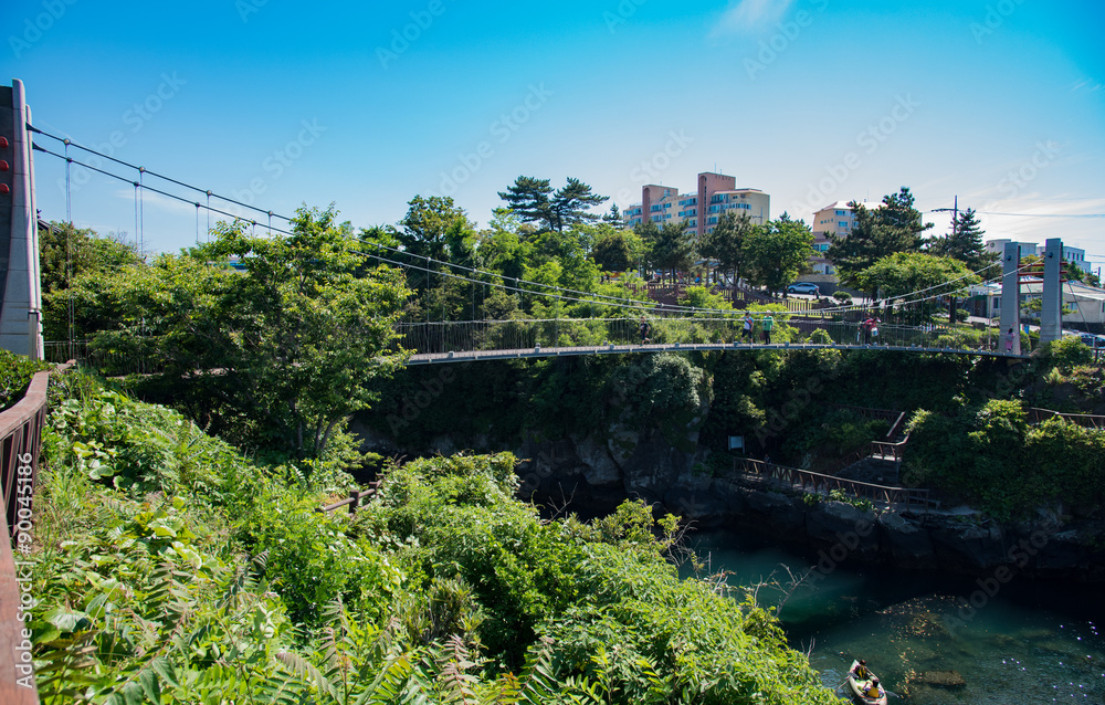 Suspension bridge near the Yongduam(Dragon Head Rock), Jeju Island, Korea