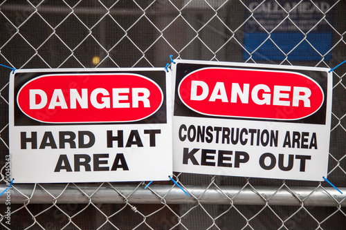 Construction site signs on fence