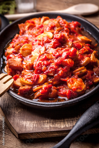 Stew with peppers, onions and sausages.