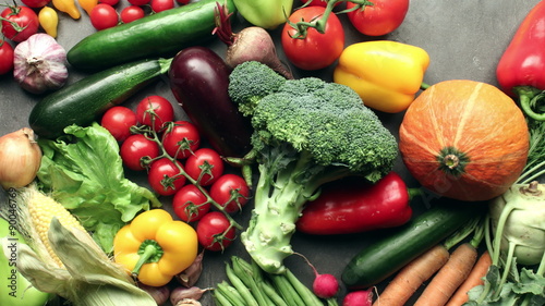 Vegetables filling entire kitchen table - harvest concept - stop motion animation