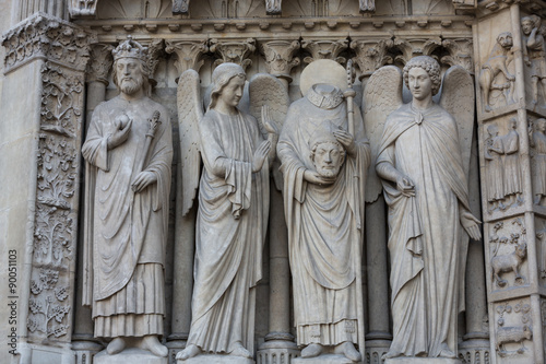 Paris - West facade of Notre Dame Cathedral. The Virgin Mary portal .