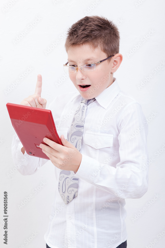 Portrait of teen boy with calculator on white background Portrait of teen boy with calculator on white background
