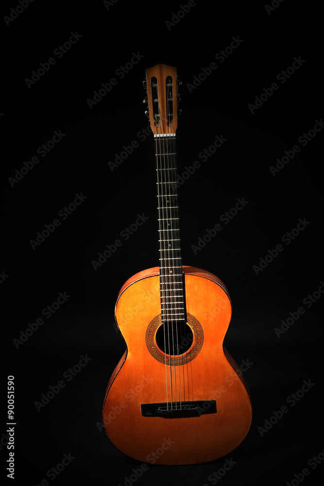Naklejka premium Classical guitar on dark background