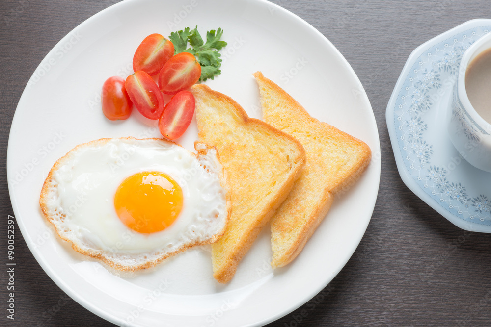 Plate of breakfast with fried eggs and bread Plate of breakfast with fried eggs and bread