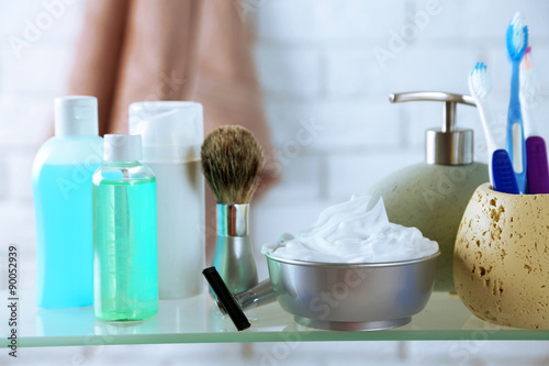 Male luxury shaving kit on shelf, on bricks wall background