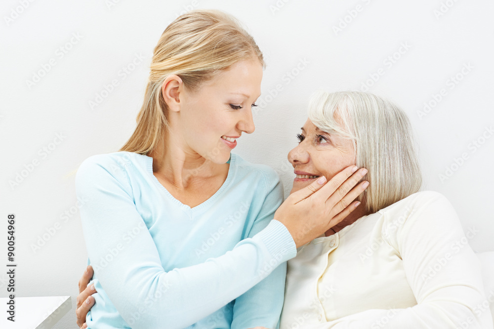 Enkelin streichelt Wange ihrer Großmutter Stock Photo Adobe Stock