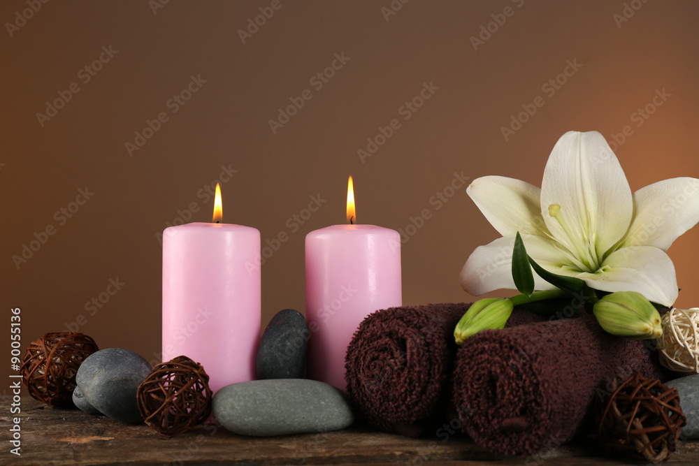 Beautiful spa composition with lily on brown background Beautiful spa composition with lily on brown background