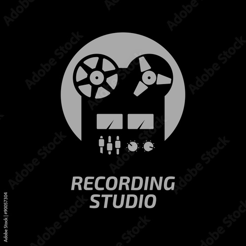 Recording studio logotype template. Black reel tape recorder on whute circle and dark background.