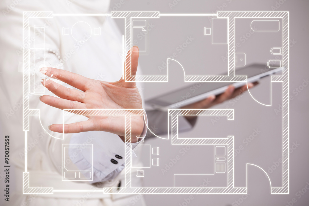 female architect working with a virtual apartment plan female architect working with a virtual apartment plan