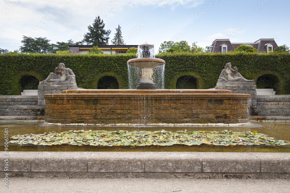 A fountain in the park of roses. Germany, Baden-Baden.