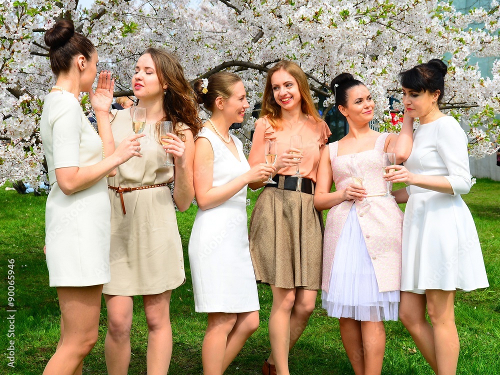Girls with champagne celebrating in sakura's garden. Girls with champagne celebrating in sakura's garden.
