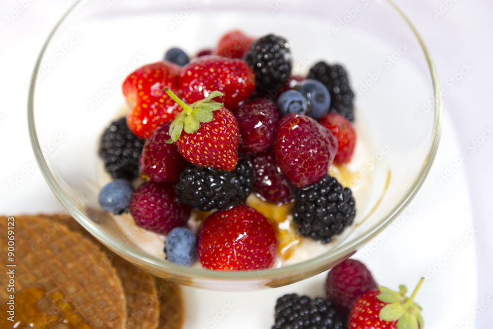 Tasty breakfast with yogurt, waffles and berries Tasty breakfast with yogurt, waffles and berries