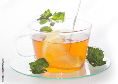 Cup of tea with lemon and mint isolated 