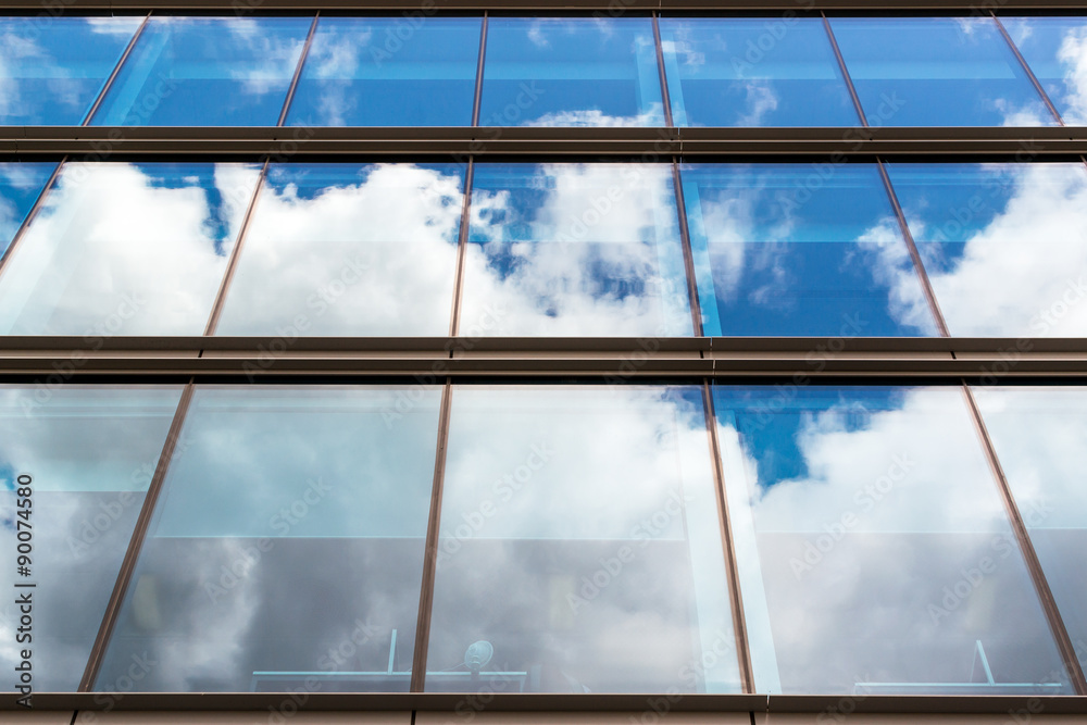 Fototapeta premium Modern Urban Building with Glass Window Reflection