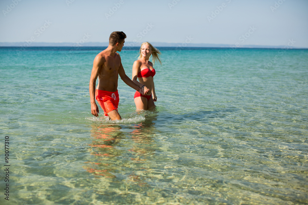 Young couple relaxing on the beach