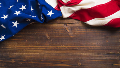 Old American Flag on wooden plank background