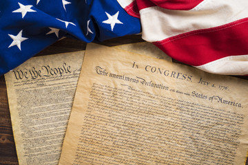 United States founding documents on a vintage American flag