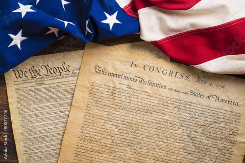 Fotografía United States founding documents on a vintage American flag