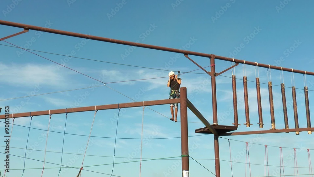 Man walking on a rope road General view Rope park Man walking on a rope road General view Rope park