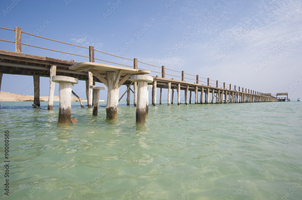 Wooden jetty on a tropical island beach Wooden jetty on a tropical island beach