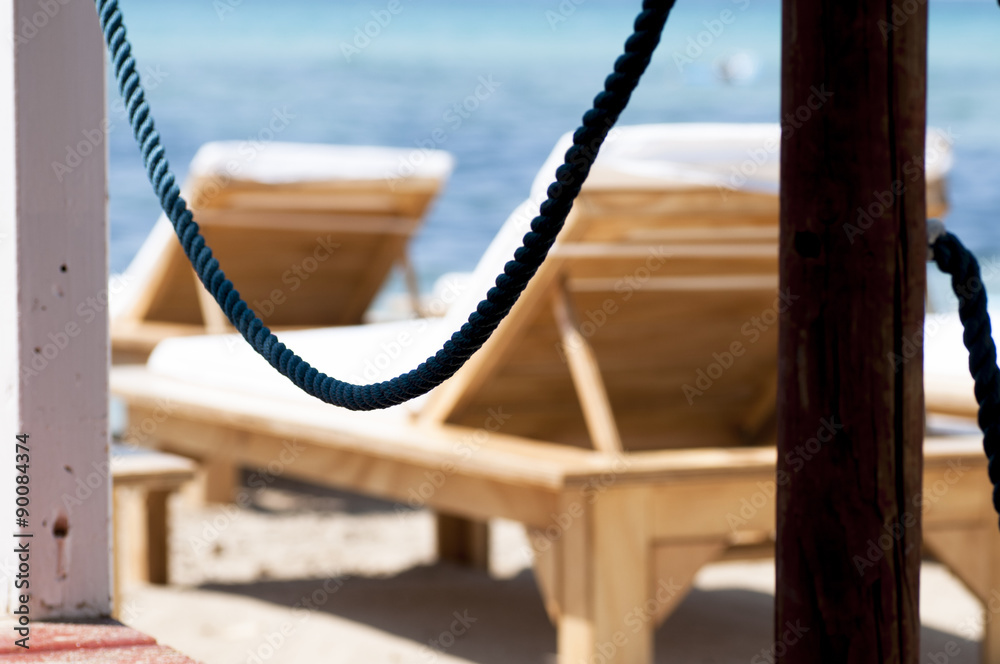 Fototapeta premium Chairs on beach near the sea