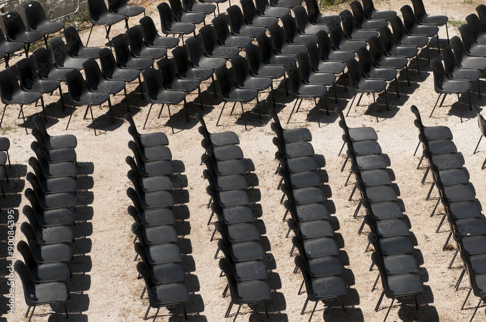 Obraz premium black chairs in a row