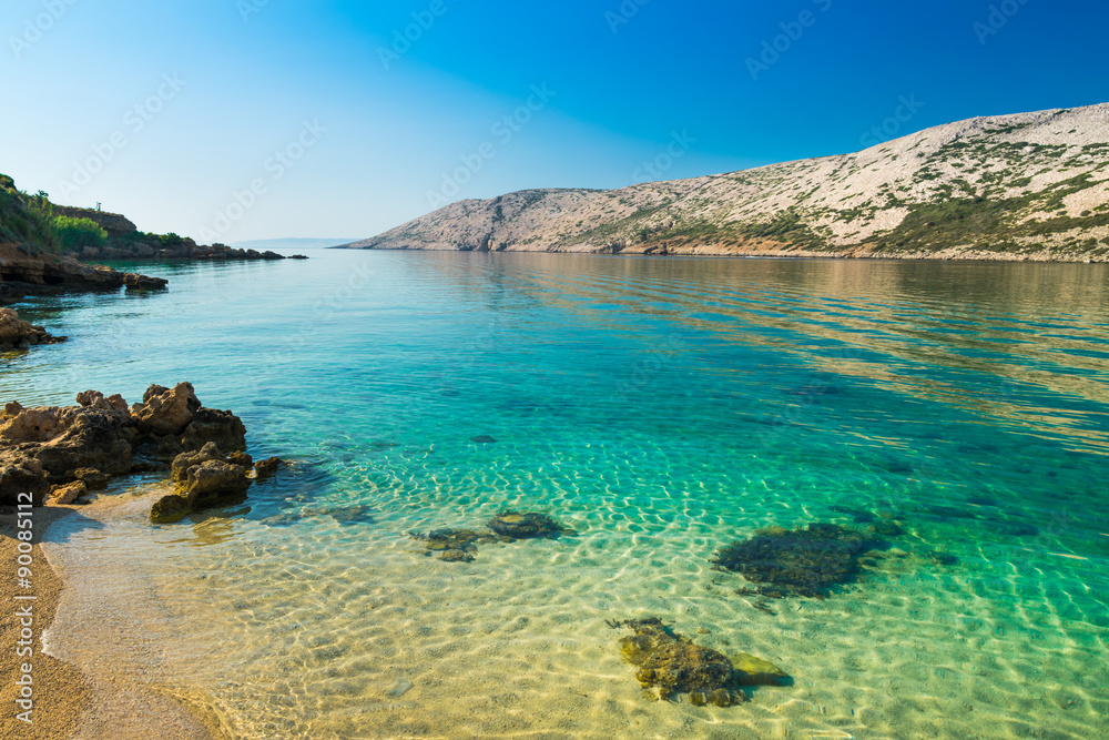 The pristine coastline and crystal clear water of the island of Rab, Croatia. The pristine coastline and crystal clear water of the island of Rab, Croatia.