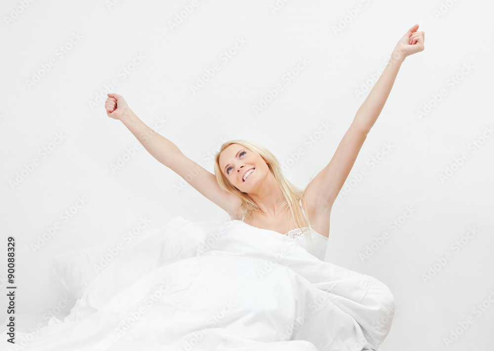 Young happy smiling woman waking up Young happy smiling woman waking up