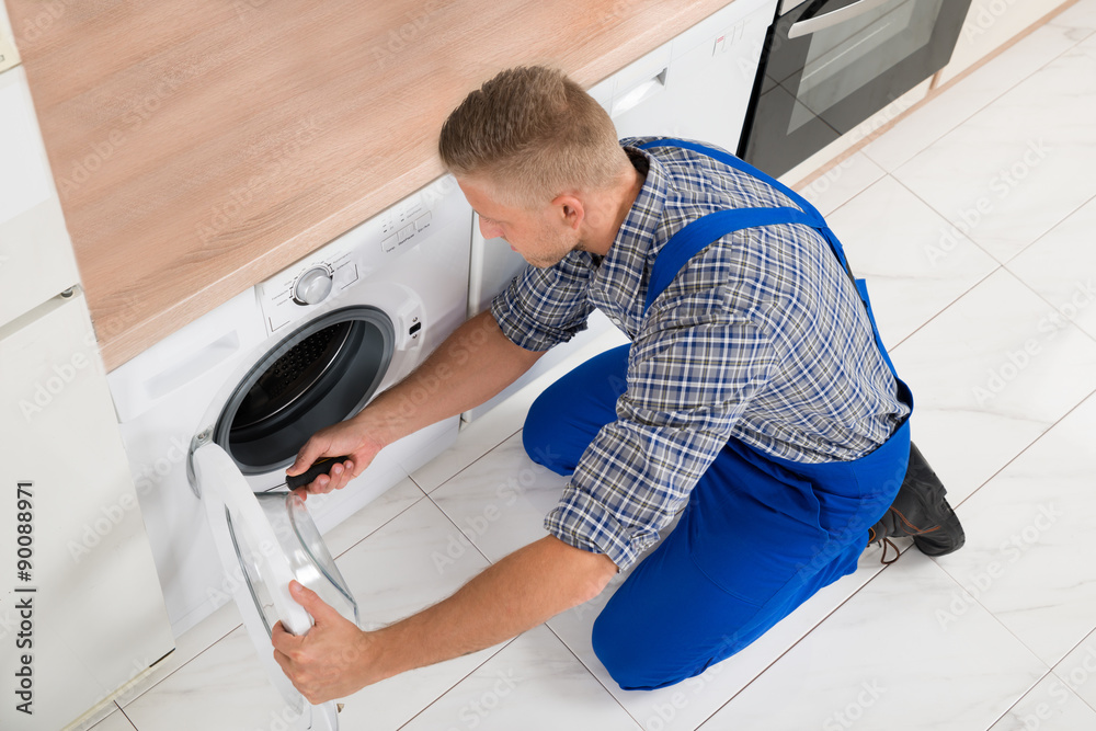Worker In Overall Fixing Washer Worker In Overall Fixing Washer