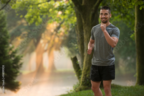 Man Runner Jogging Outdoor Workout In A Park