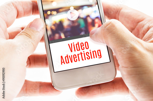 Close up Two hand holding mobile with Video Advertising word, Di