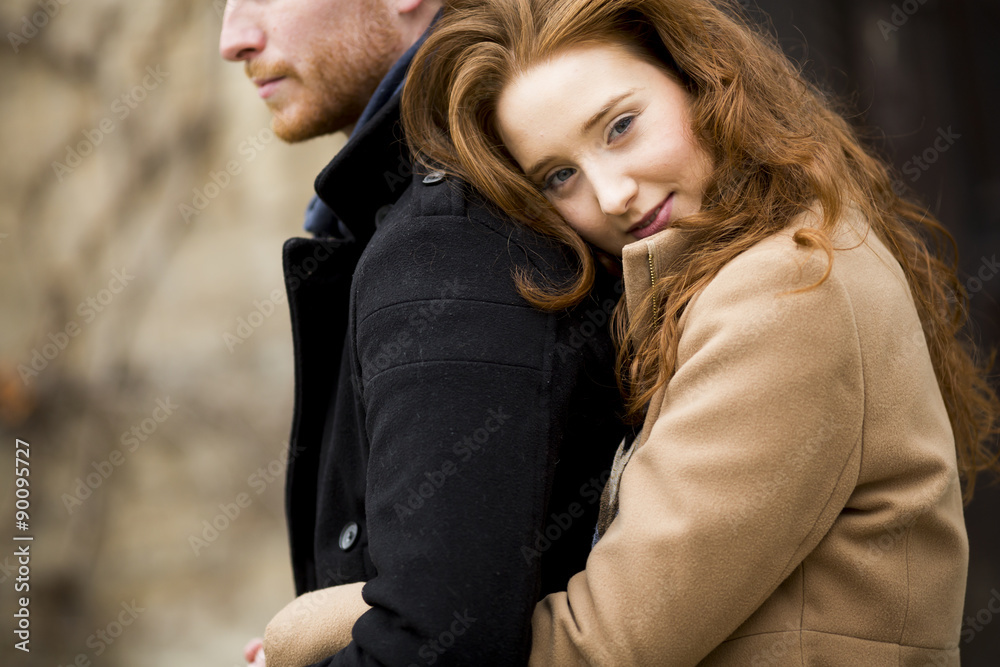 Fototapeta premium Young red hair couple at autumn park