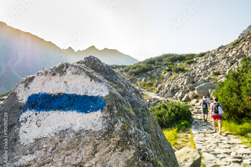 Hikers on a trail in beautiful mountains