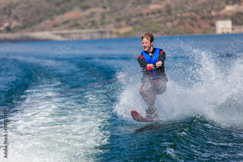 Water Skiing Teenager Boy fun action on single ski slalom