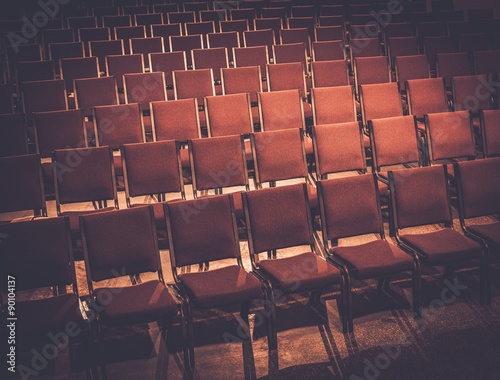 Empty comfortable red seats in a hall