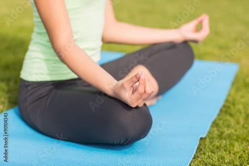 Sporty woman meditating 