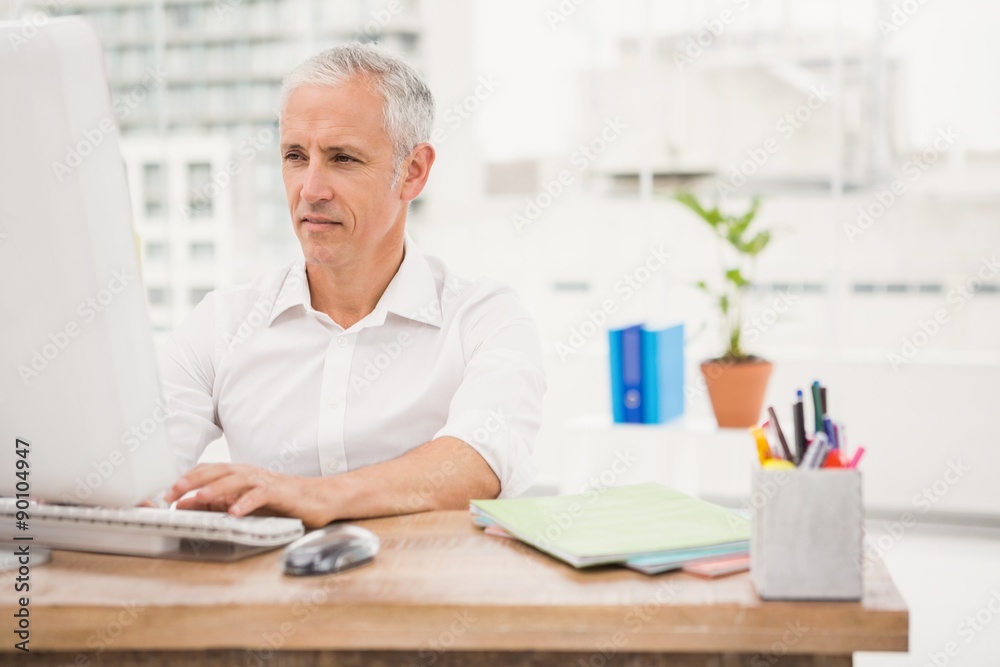 Casual businessman working with computer Casual businessman working with computer