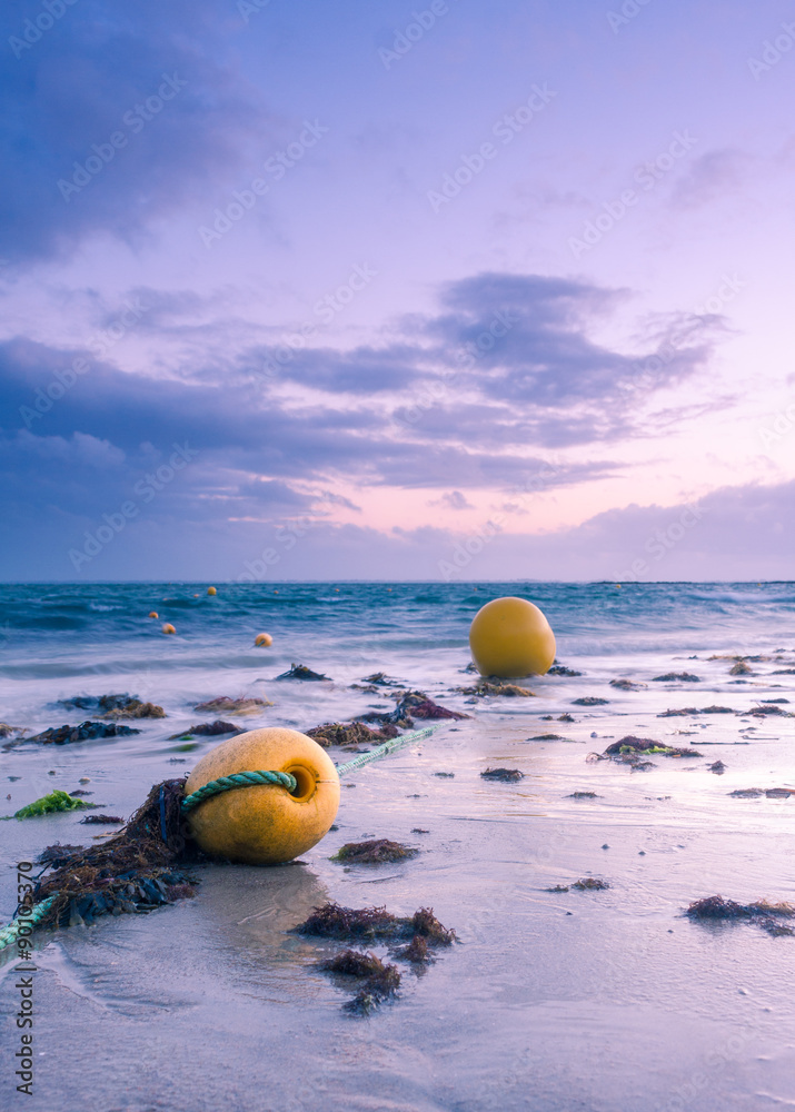 Yellow buoys at dusk