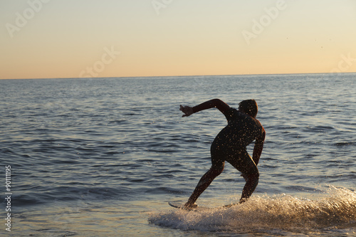 Surfing in San Pol de Mar in the coast of Catalonia, Spain photo