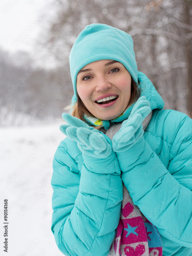 Young happy woman at the winter park. Young happy woman at the winter park.