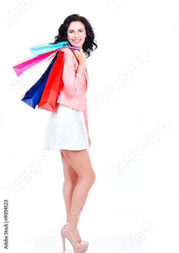 Beautiful brunette woman with shopping bags.