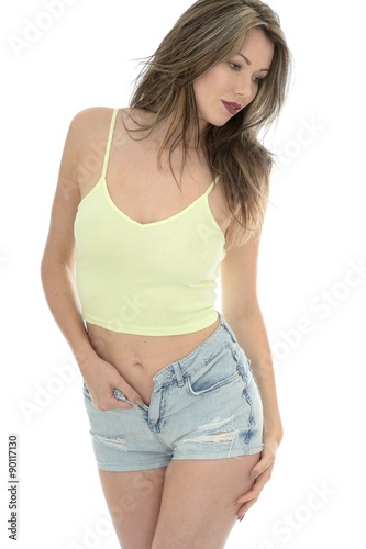 Sexy Young Woman In A Vest Top and Denim Jeans