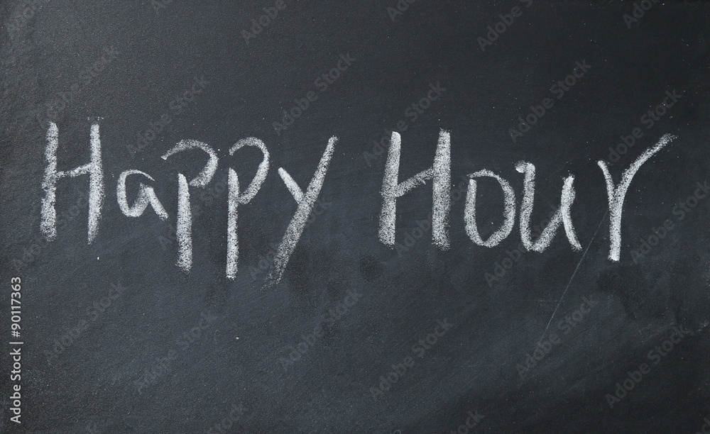 Obraz premium happy hour text write on blackboard