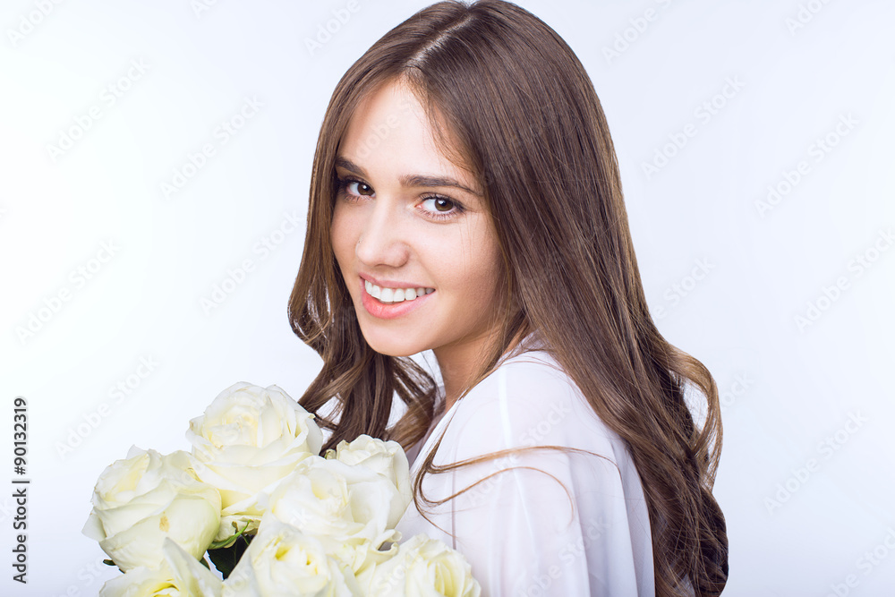 Young girl with a bouquet white roses Young girl with a bouquet white roses