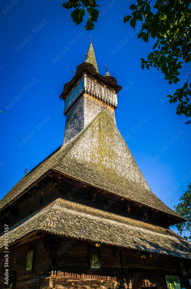 Old wooden church in Budesti Josani village, Maramures county, northern Romania. Traditional wooden church in Maramures area, Romania