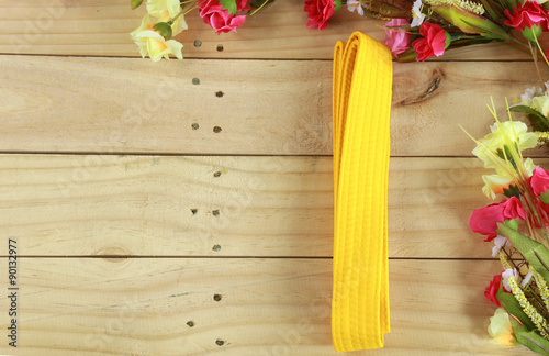 Color belt of martial art on wood floor