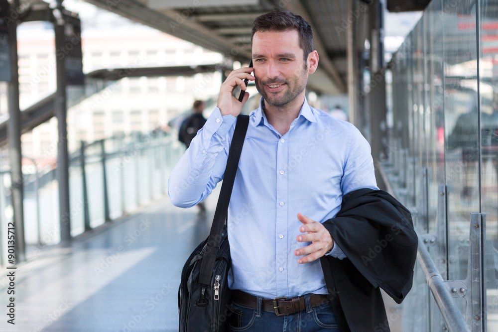 Young attractive business man using smartphone Young attractive business man using smartphone